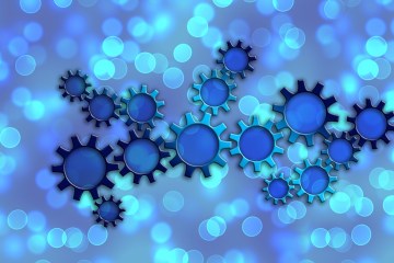 Graphic of gears interspersed with shining blue dots